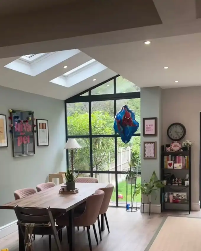 A bright dining room with skylights, cleaned glazing and vacuumed floors