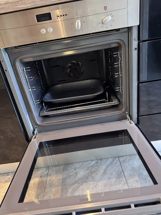 The same oven fully cleaned, with clear glass door and spotless interior